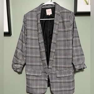 Pink, black and white plaid blazer.